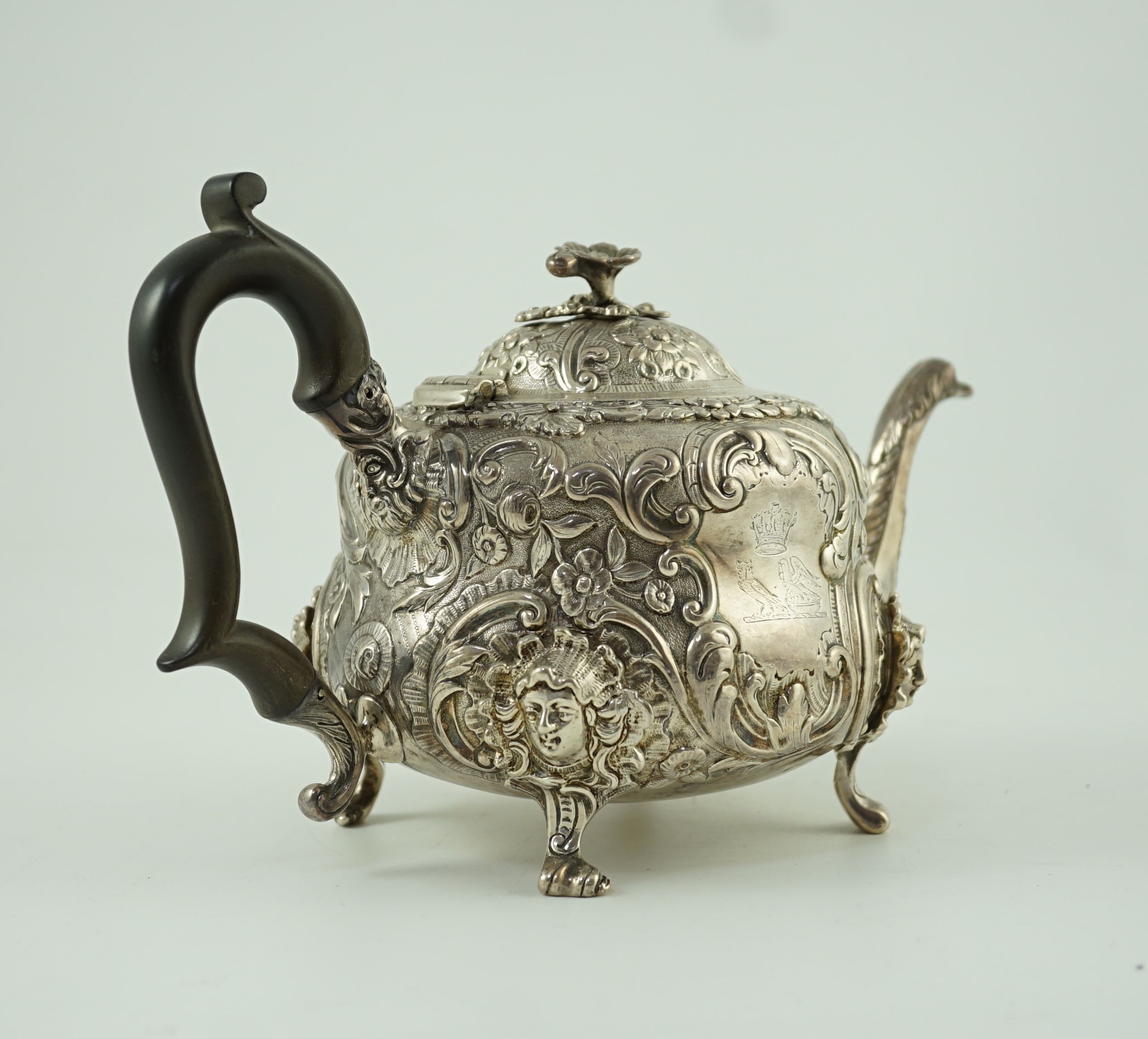 An early Victorian embossed silver teapot, by William Moulson